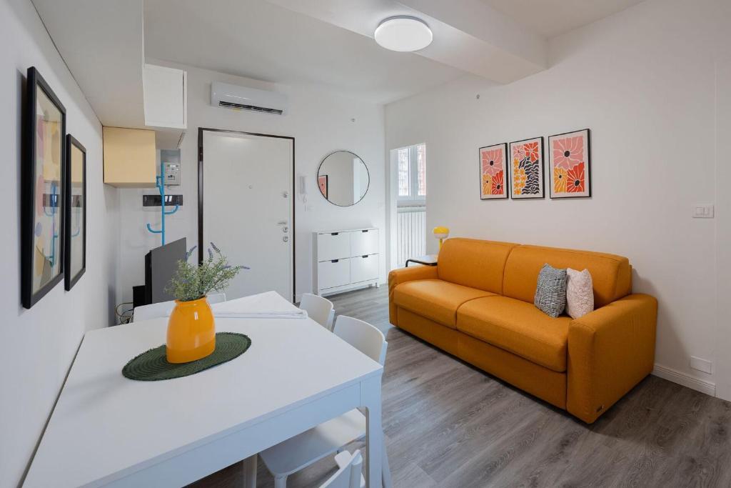 a living room with a couch and a table at Italian Experience- Aselli Home in Pavia