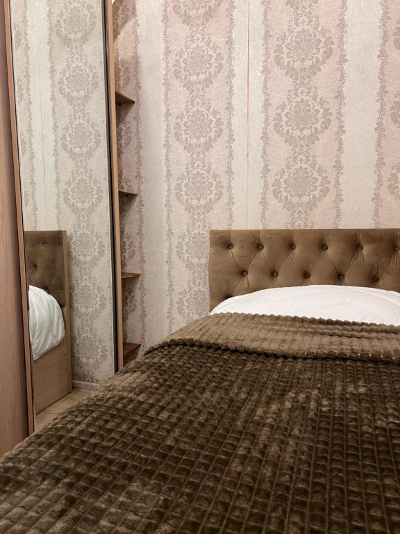 Ένα ή περισσότερα κρεβάτια σε δωμάτιο στο Central & Comfortable - Gldani