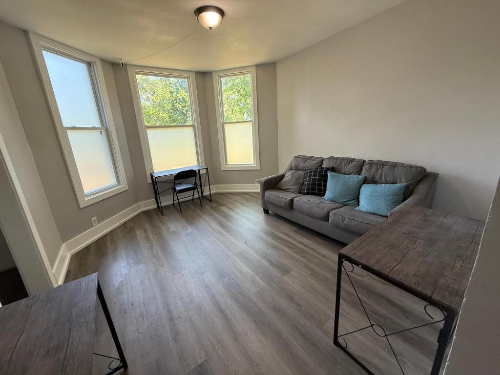 a living room with a couch and a table at Beautiful Home Near Downtwon - Free Parking! in Chicago