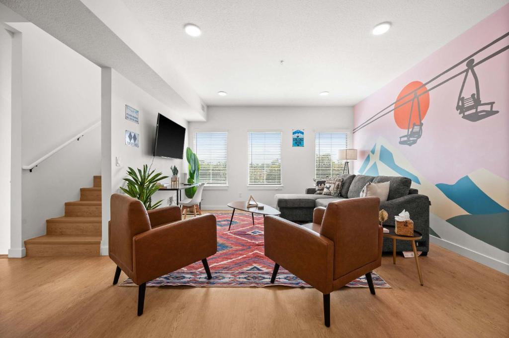 a living room with a couch and a table at Cozy Ski Lodge 2BR 2BA Rooftop Garage in Salt Lake City