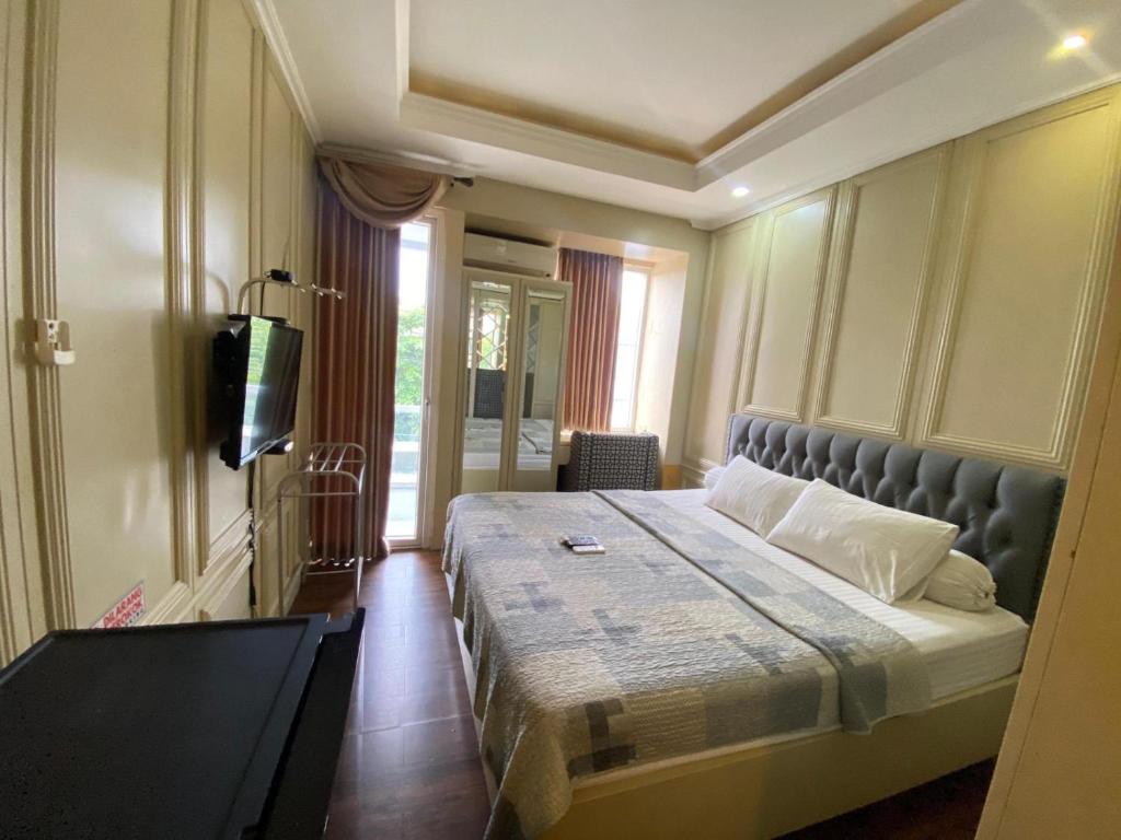 Ein Bett oder Betten in einem Zimmer der Unterkunft Vinsroom Dua