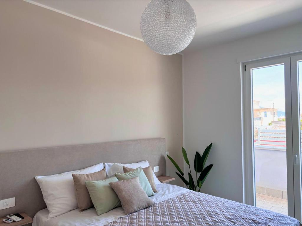 Ένα ή περισσότερα κρεβάτια σε δωμάτιο στο Harmonia