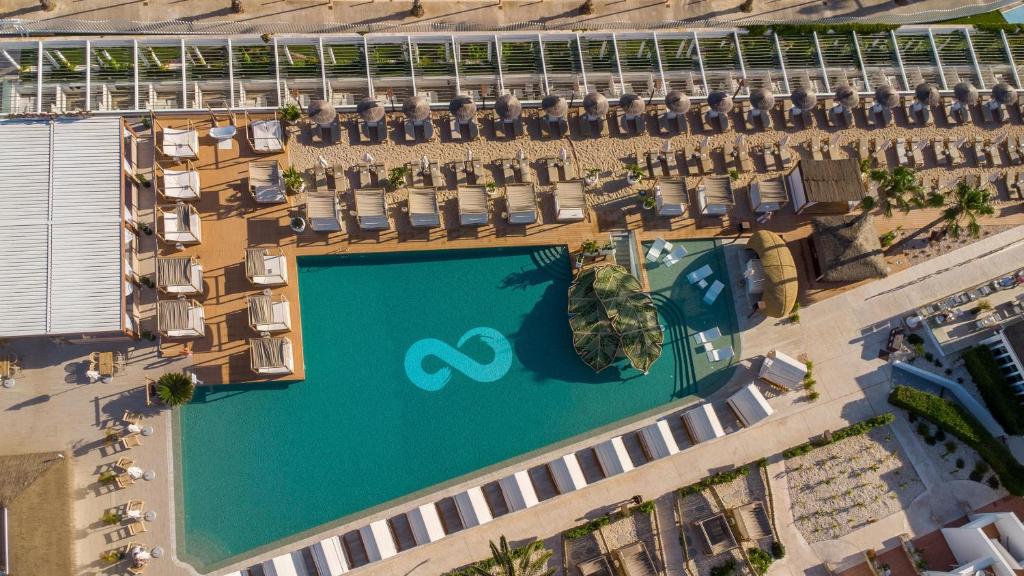an overhead view of a swimming pool at a resort at Lago Resort Menorca - Casas del Lago Adults Only in Cala en Bosc