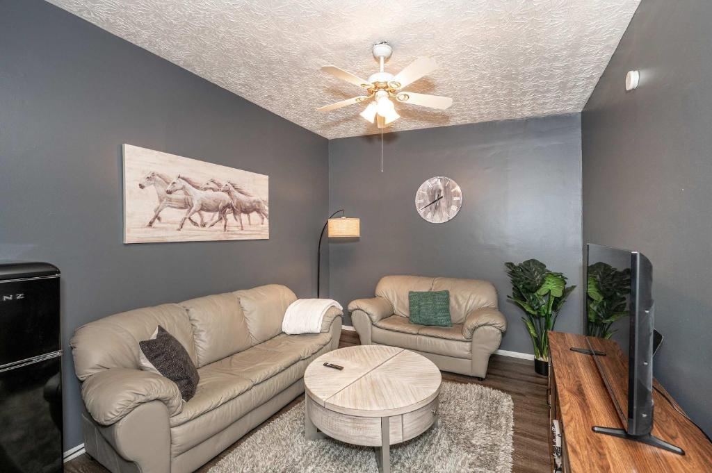a living room with a couch and a table at Monmouth Loft 4 - Walk to Shops in Newport