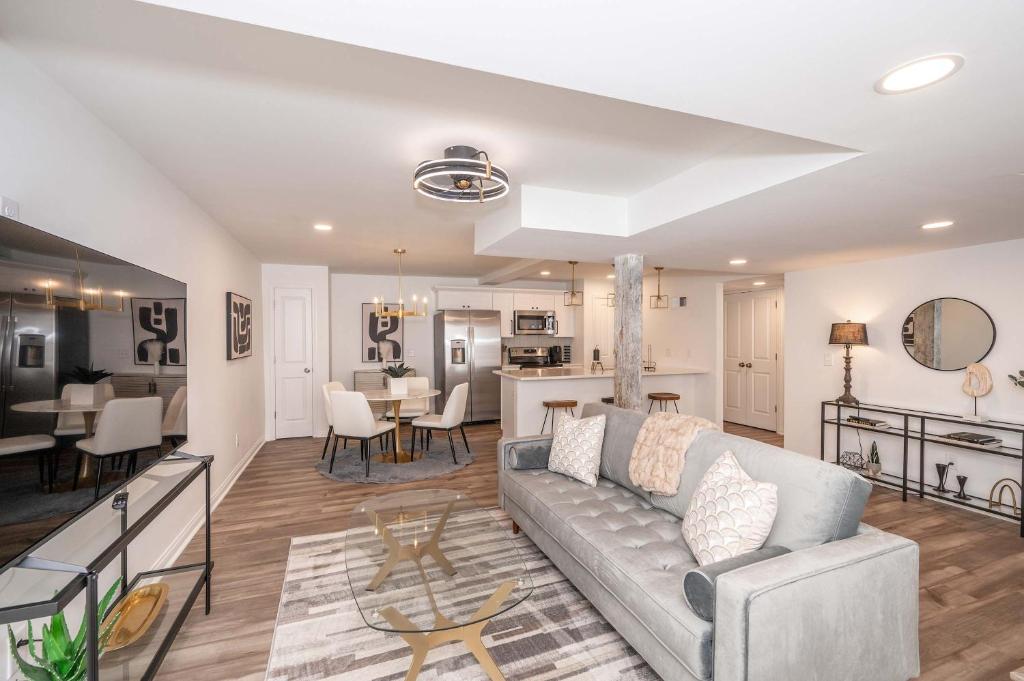 a living room with a couch and a table at Covington Charm 101 in Covington
