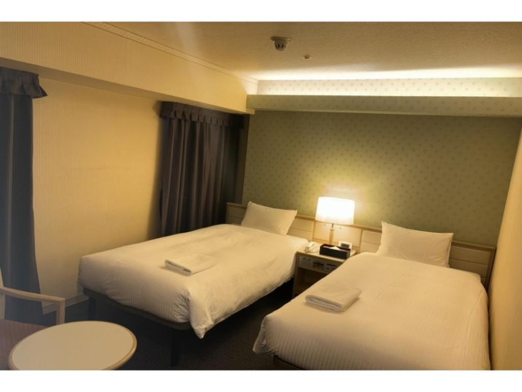 Кровать или кровати в номере Shinyokohama Kokusai Hotel - Vacation STAY 62855v