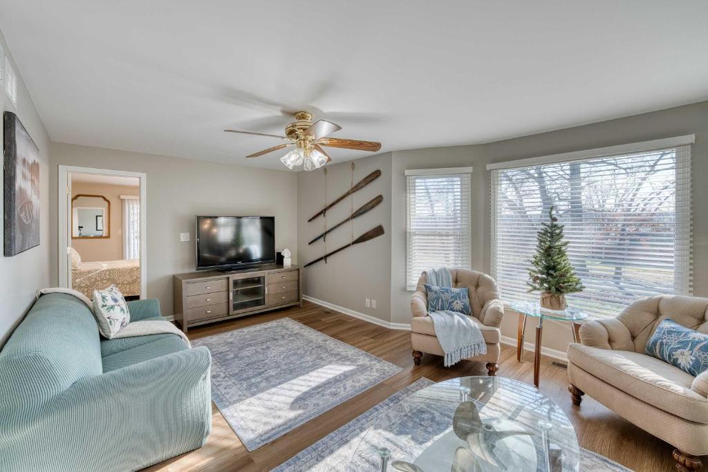 a living room with two couches and a tv at Vida del Lago - 3 Bedroom Near Geneva National in Lake Geneva