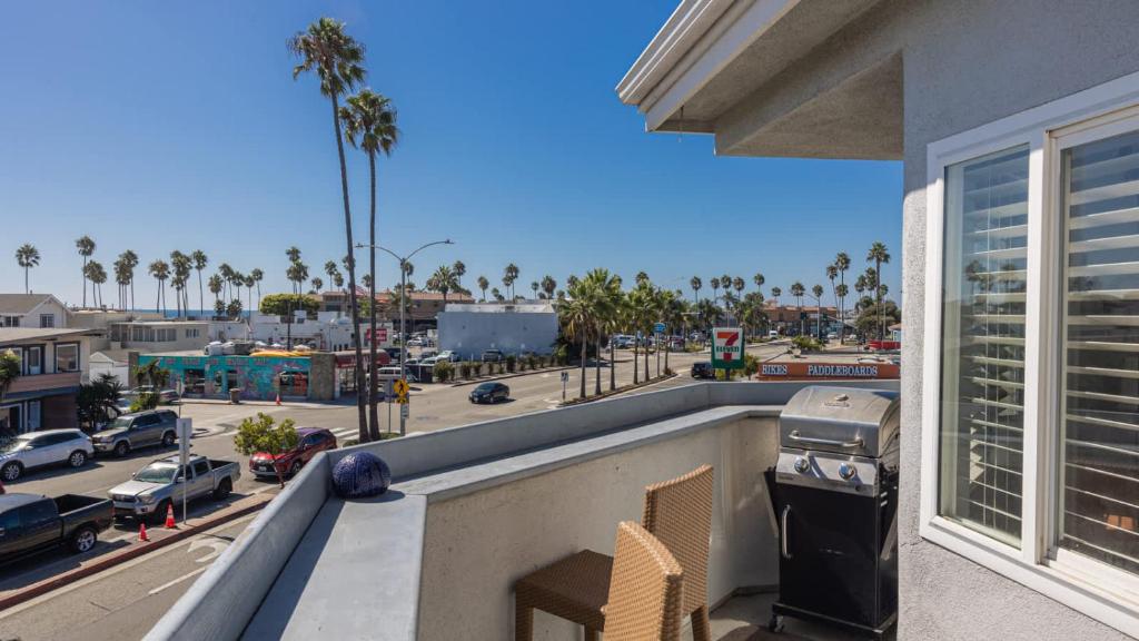 a balcony with a view of a city street at Balboa Escape An Iconic Stay in Newport Beach