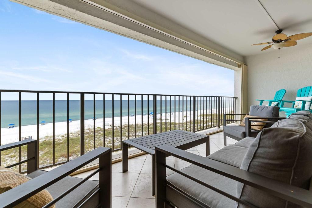 a living room with a view of the beach at Spacious Beachfront Retreat - Sauna Pools & More in Perdido Key