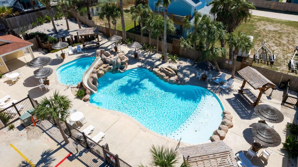 an overhead view of a swimming pool with a slide at Fun 4 Bedroom - Resort Pool Sleeps 12 in Port Aransas