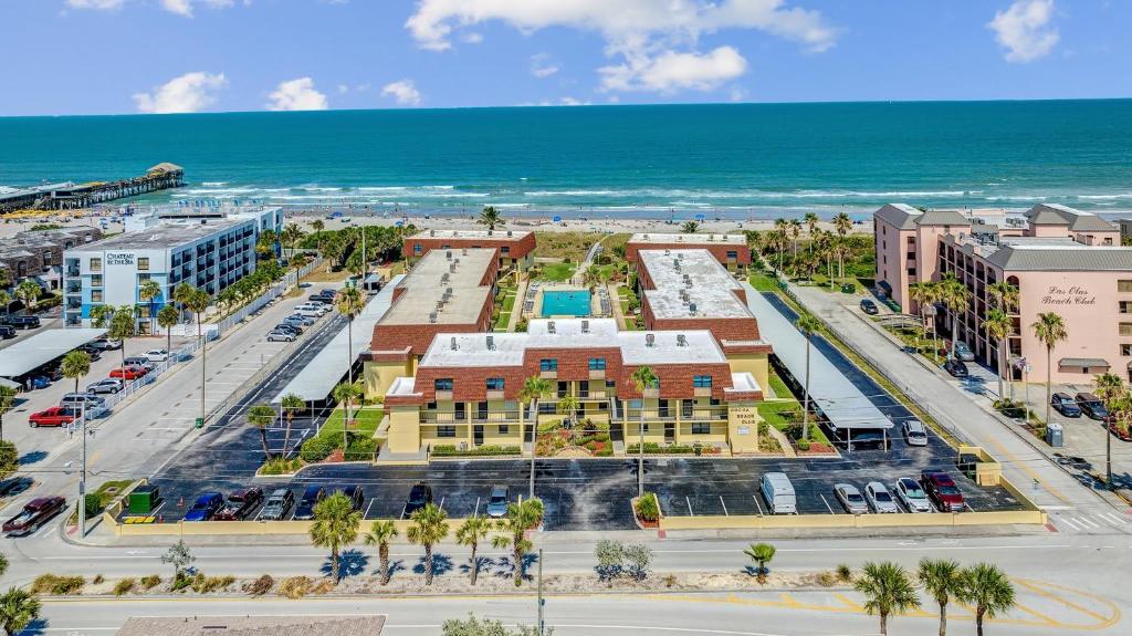 an aerial view of a city with the ocean at 2BR Sleeps 6 Pool BBQ Steps to Beach Pier Downtown in Cocoa Beach