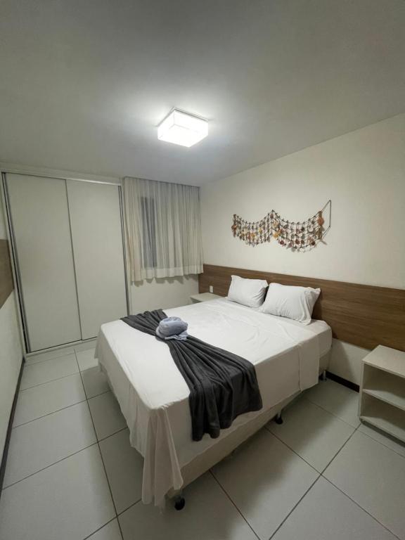 Ένα ή περισσότερα κρεβάτια σε δωμάτιο στο Apartamento no Iloa Residence