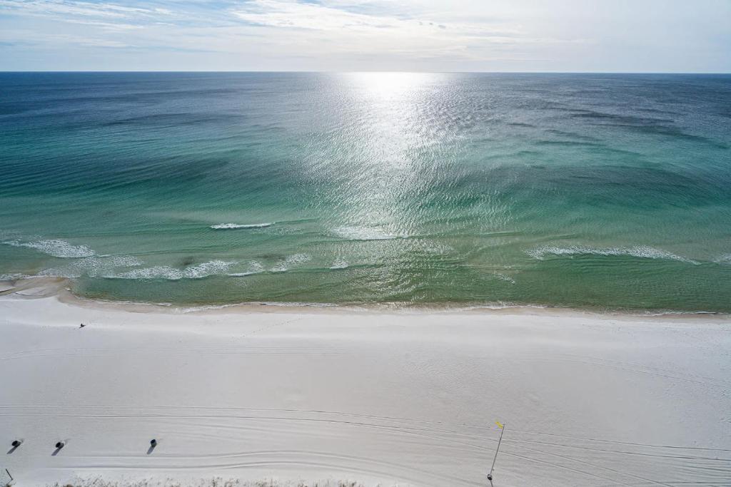 an aerial view of a beach and the ocean at Beachfront Haven 2 BDR Kid-Friendly Resort in Panama City Beach