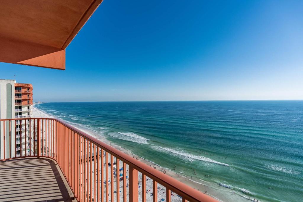 a view of the ocean from the balcony of a building at Sunset Shores - Oceanfront Condo Bliss in Panama City Beach