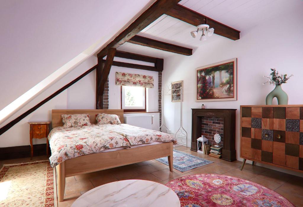 a bedroom with a bed and a fireplace at Art Maison Krumlov in Český Krumlov