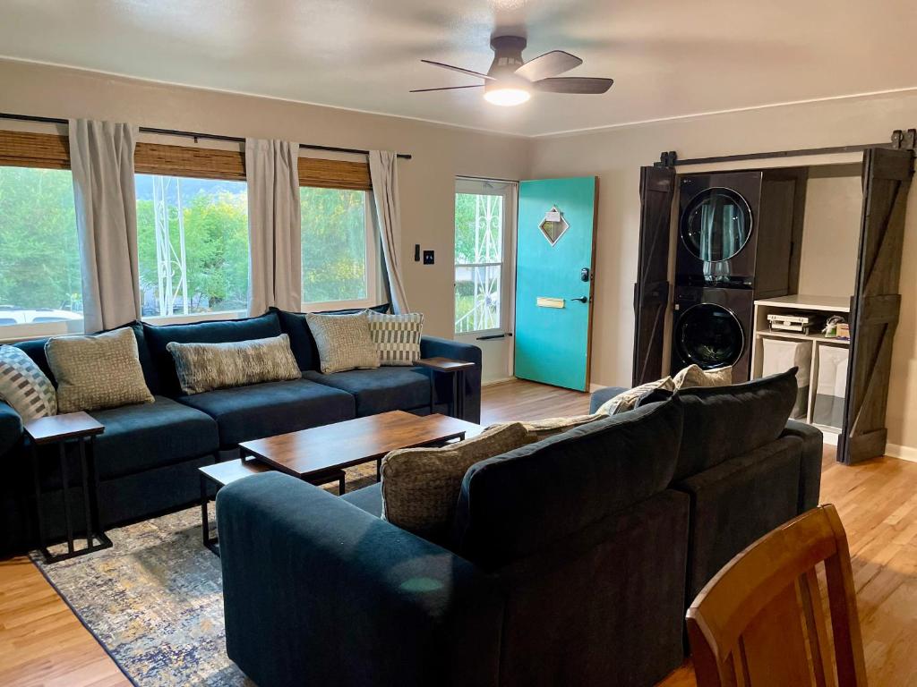 a living room with a couch and a table at One Blue Rose in Colorado Springs