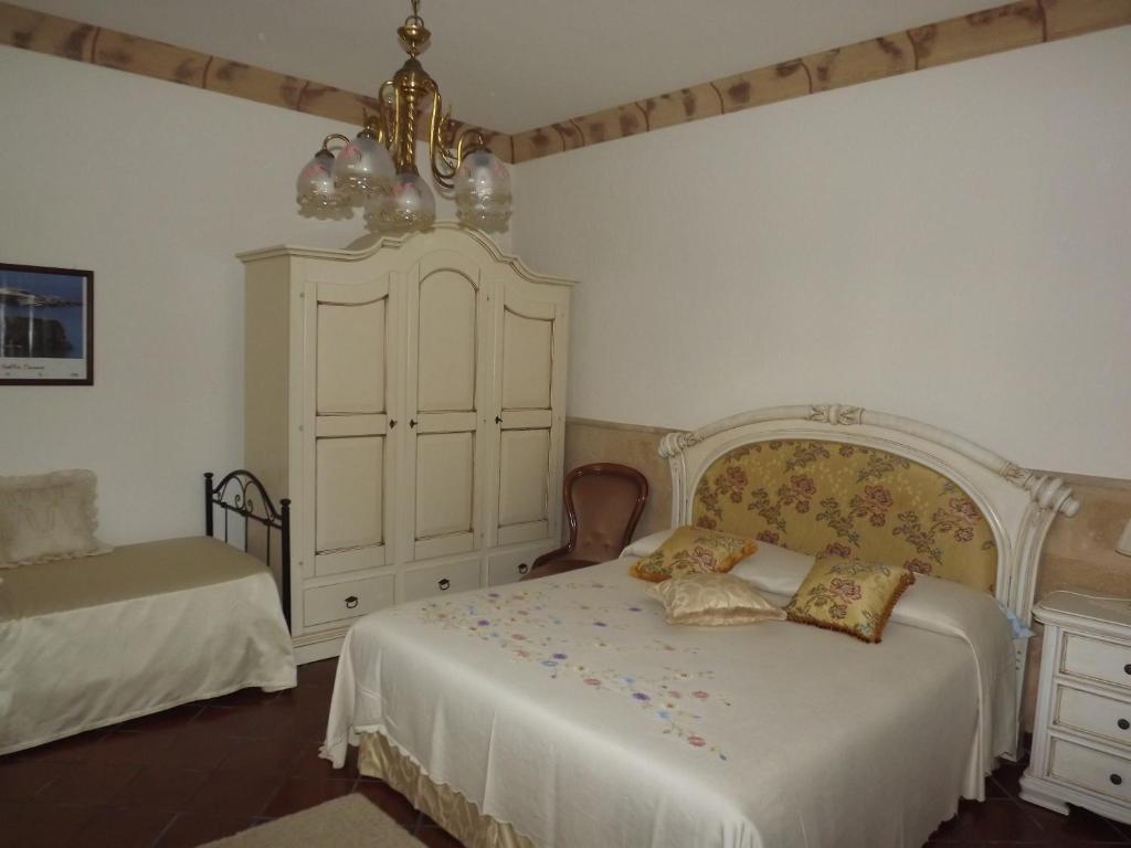 Postel nebo postele na pokoji v ubytování B&b La Balaustra