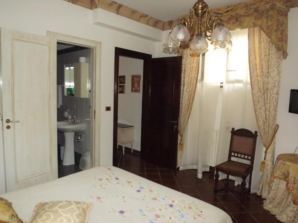 Postel nebo postele na pokoji v ubytování B&b La Balaustra