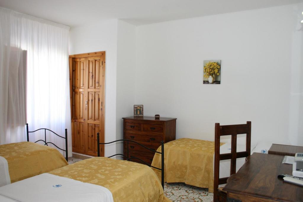 Postel nebo postele na pokoji v ubytování Hotel Tesoriero