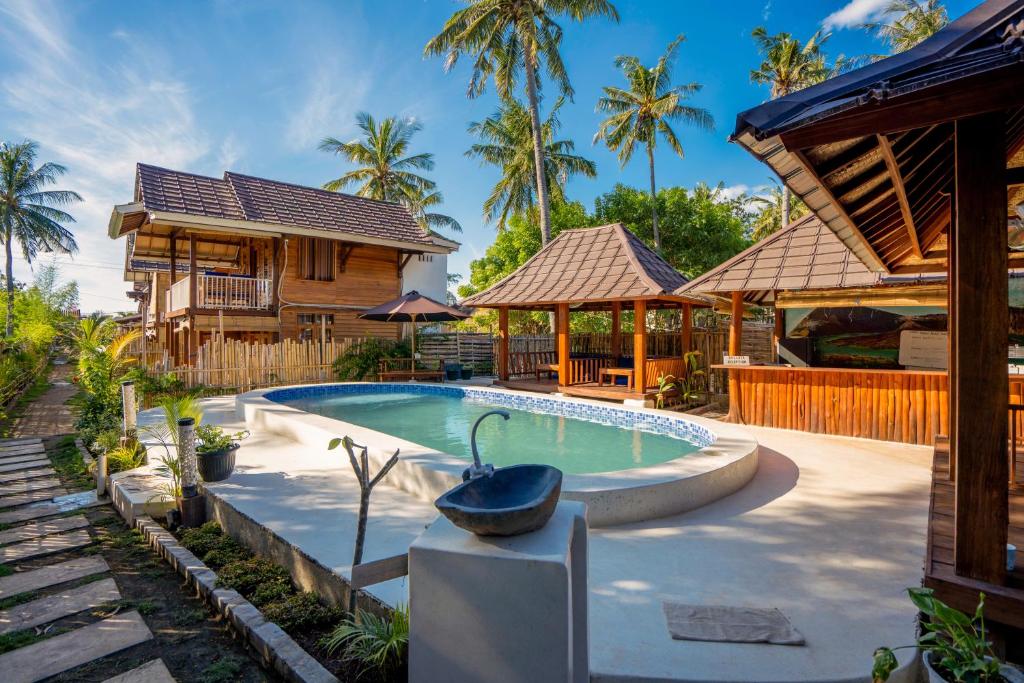 吉利阿尔Bollata Beach House的房子里的游泳池的图片