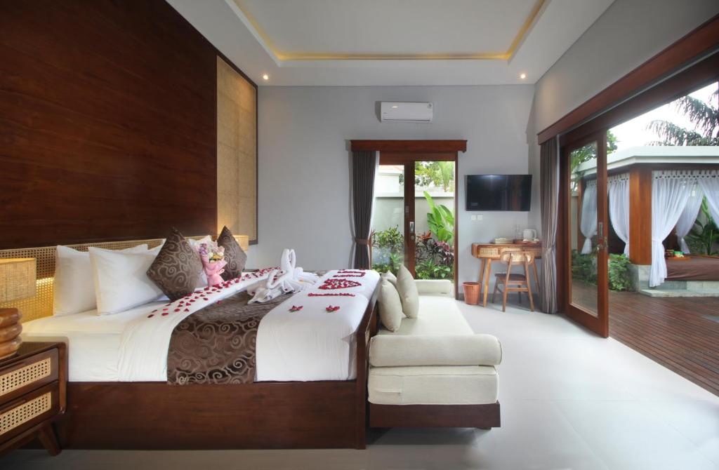 Postel nebo postele na pokoji v ubytování Tanah Wuk Villas