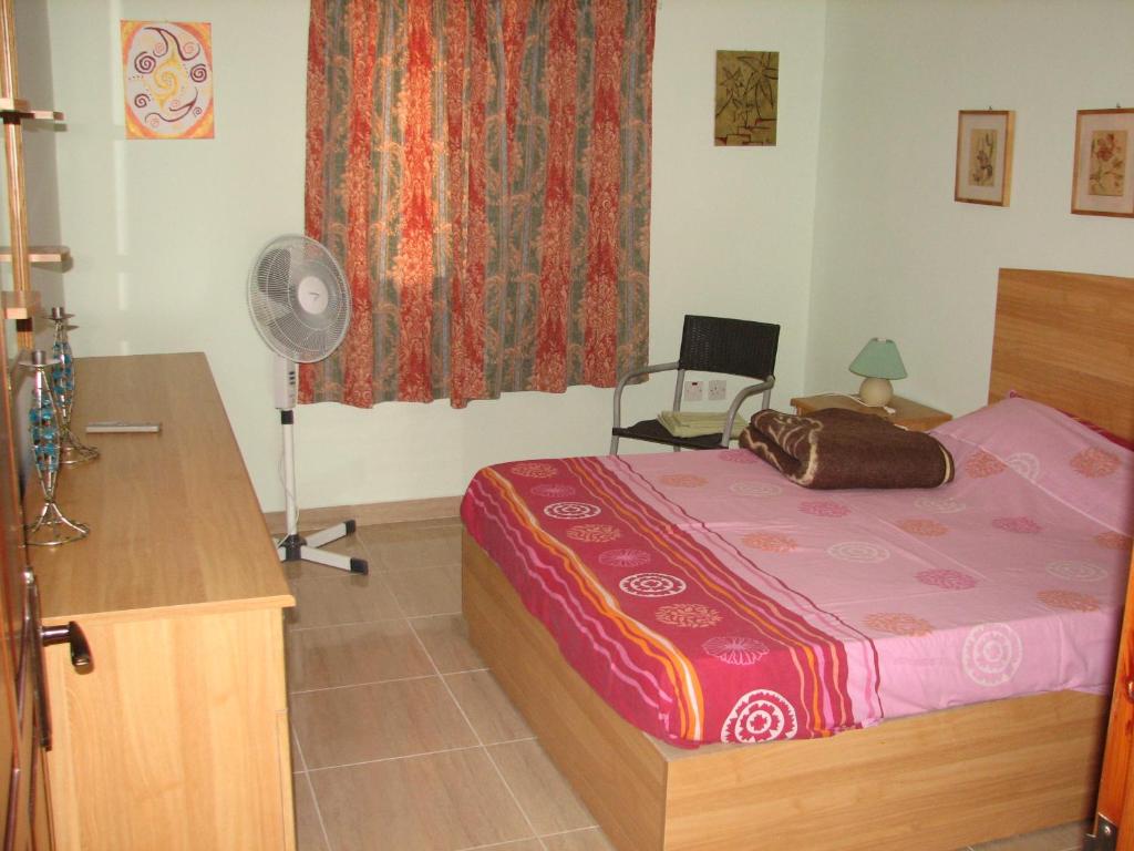 Postel nebo postele na pokoji v ubytování SeaFront Apartment Marsascala