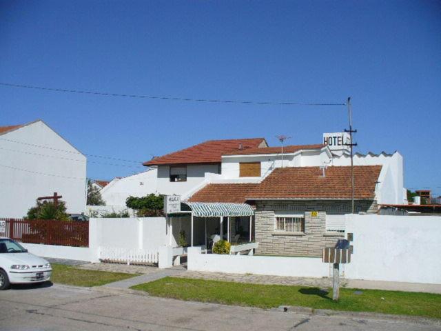 
a white van parked in front of a house at Mar del Faro in Mar del Plata
