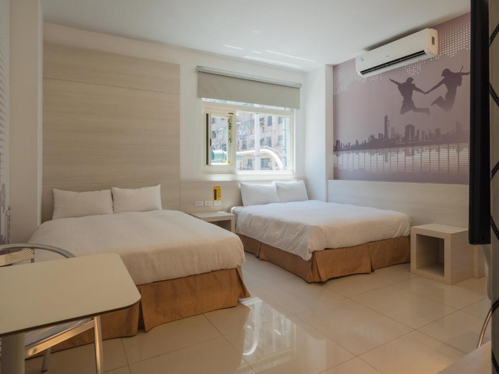Postel nebo postele na pokoji v ubytování 寓旅宿 Apato Cityhome