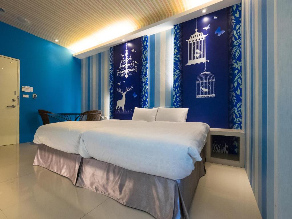 Postel nebo postele na pokoji v ubytování 寓旅宿 Apato Cityhome