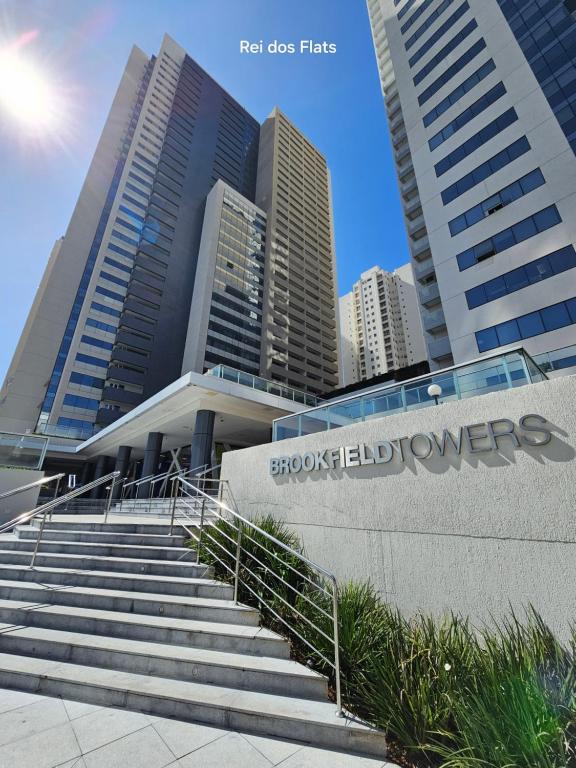 a set of stairs in front of a building with buildings at Brookfield Towers - Jardim Goiás By Rei dos Flats in Goiânia