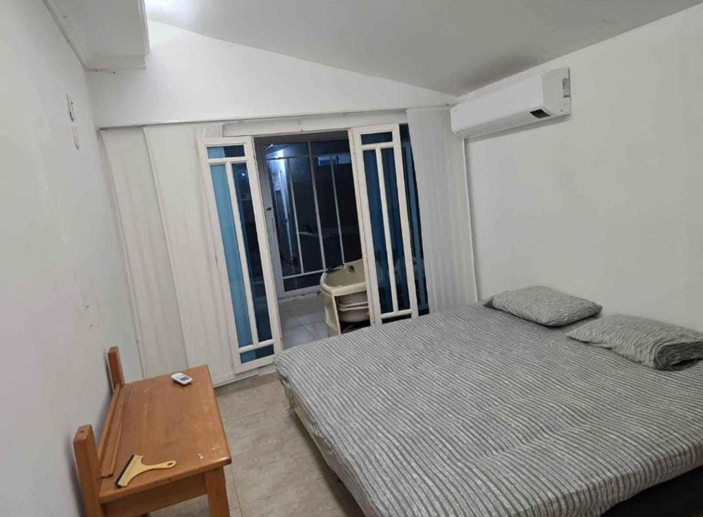 Postel nebo postele na pokoji v ubytování CASA QUINTA INCRIEBLE EN RICAURTe CUNDINAMARCA