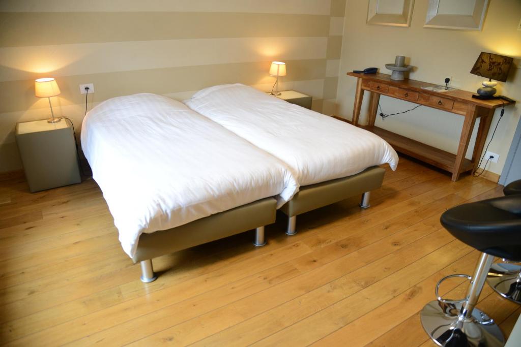Postel nebo postele na pokoji v ubytování Race & Rooms