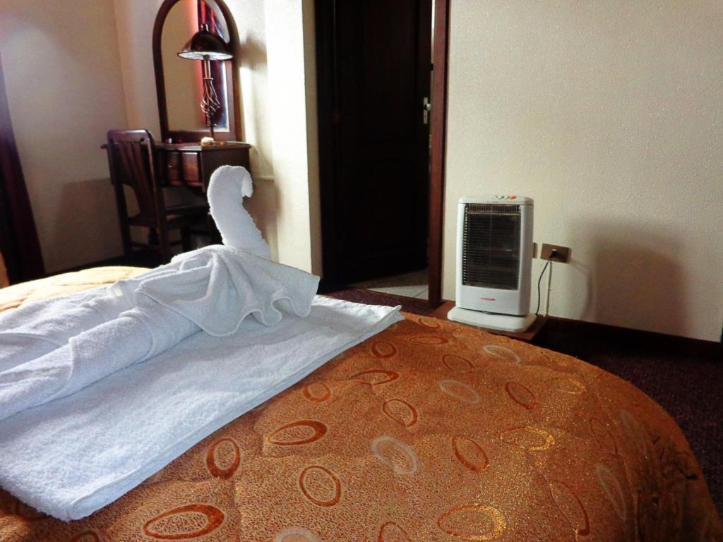 Postel nebo postele na pokoji v ubytování Hotel Alexander
