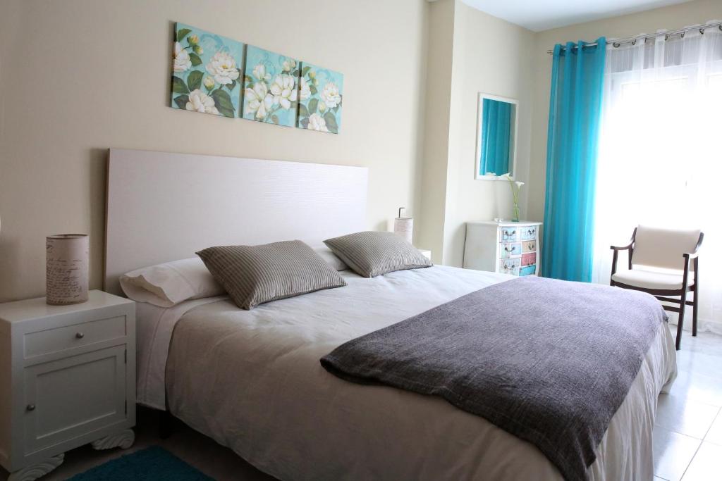Posteľ alebo postele v izbe v ubytovaní Habitaciones Castelao