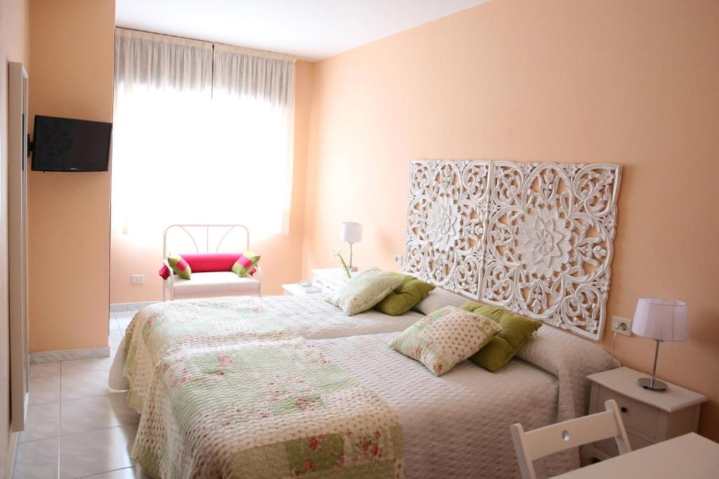 Posteľ alebo postele v izbe v ubytovaní Habitaciones Castelao