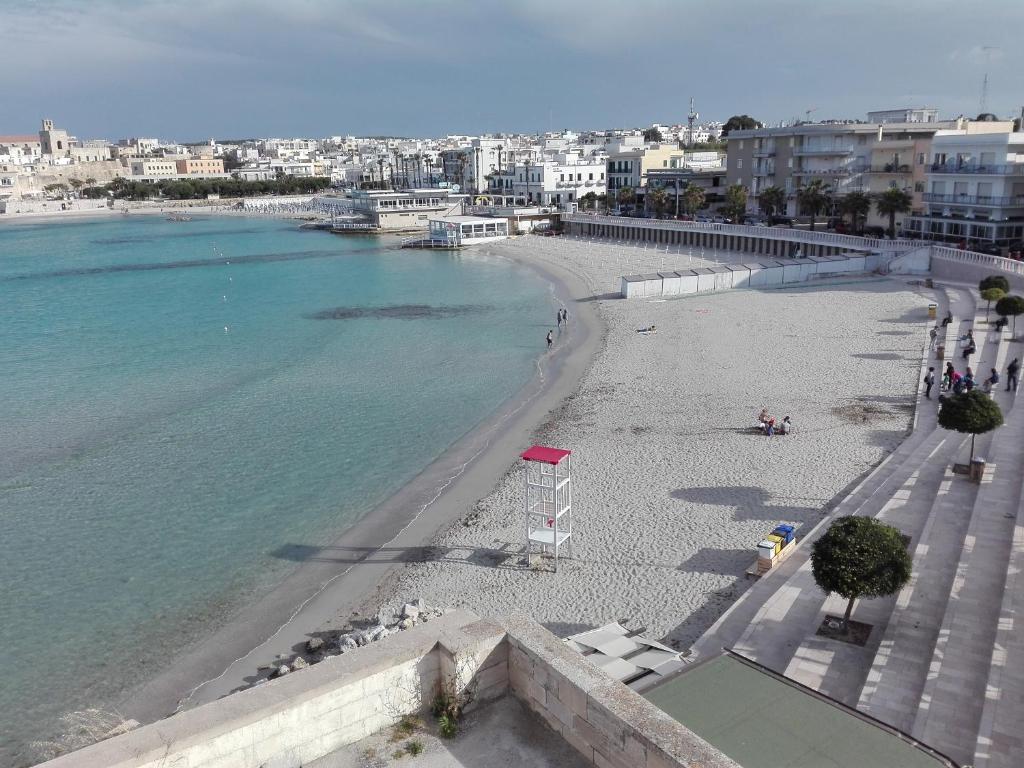 a view of a beach next to the water at Casa Vacanze " ORTE " in Otranto