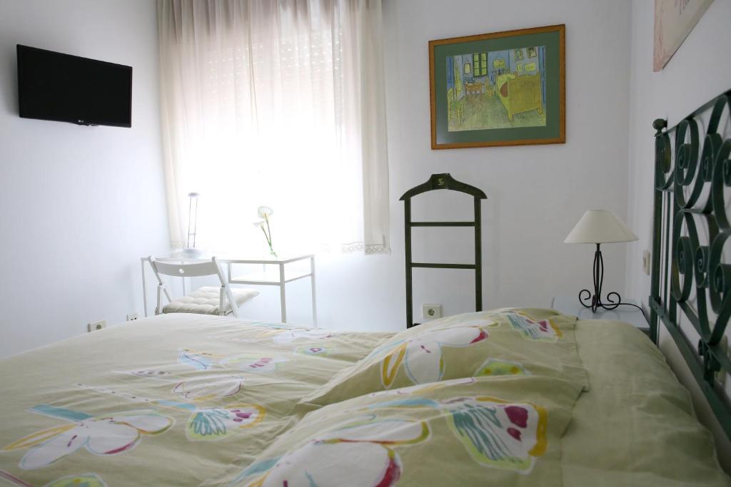 Posteľ alebo postele v izbe v ubytovaní Habitaciones Castelao