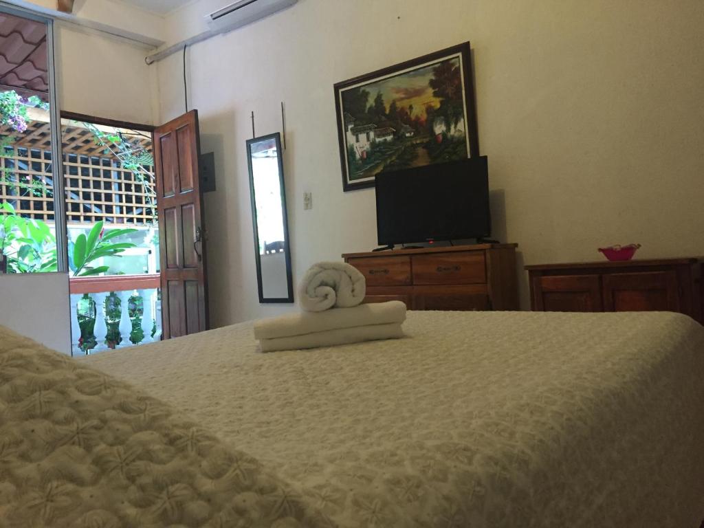 Postel nebo postele na pokoji v ubytování Hotel Coco Beach