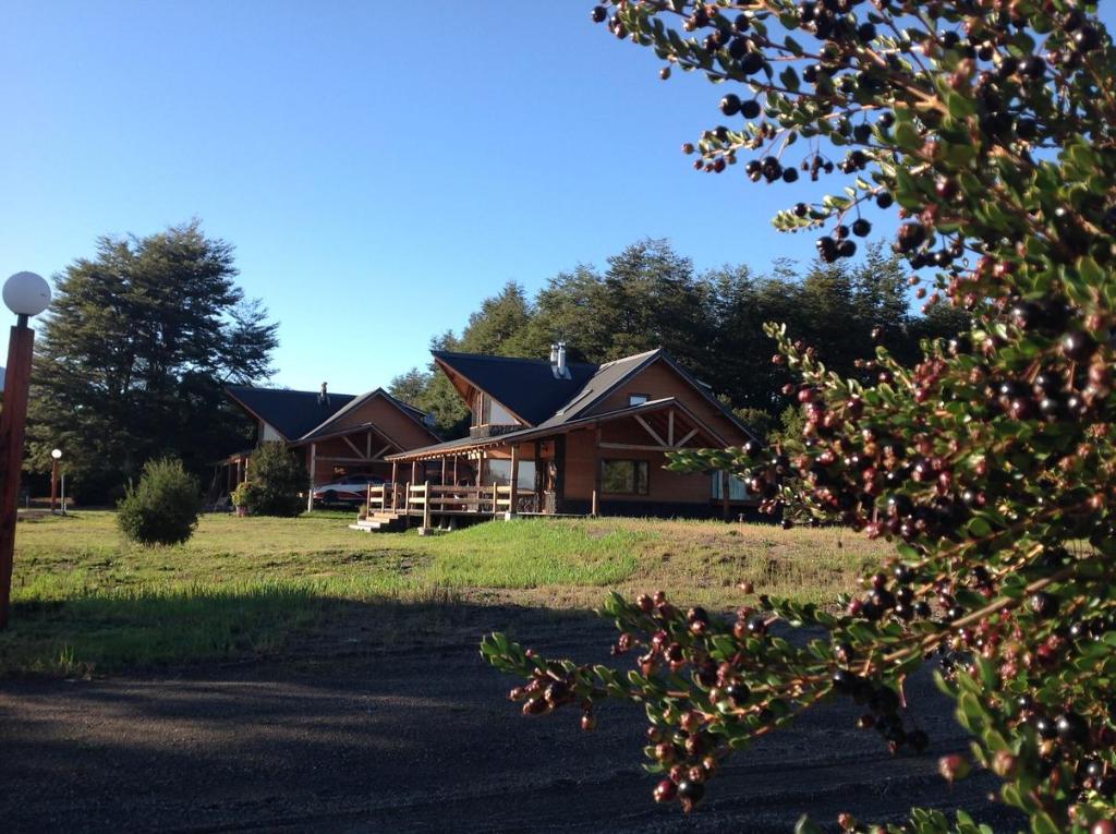 a large house in the middle of a field at Martina Bungalows in La Ensenada