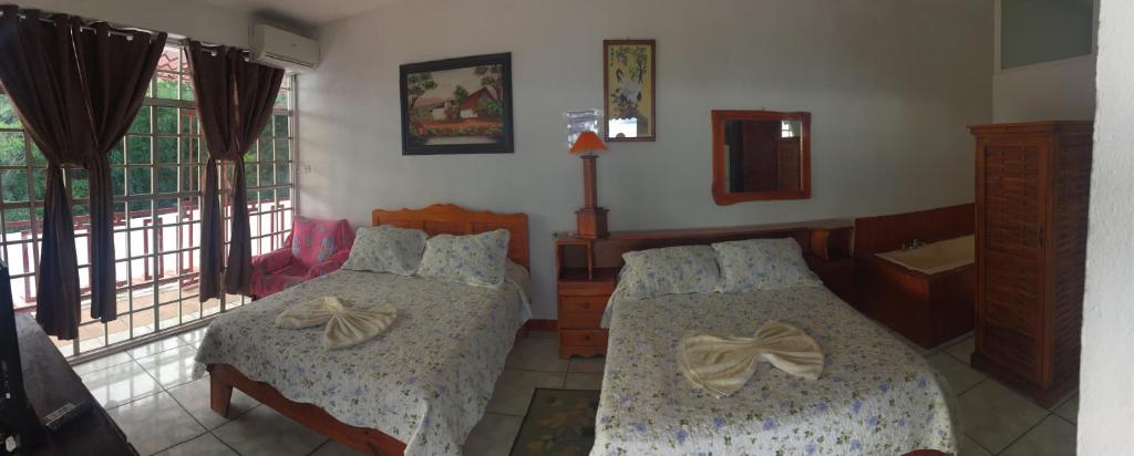 Postel nebo postele na pokoji v ubytování Hotel Coco Beach