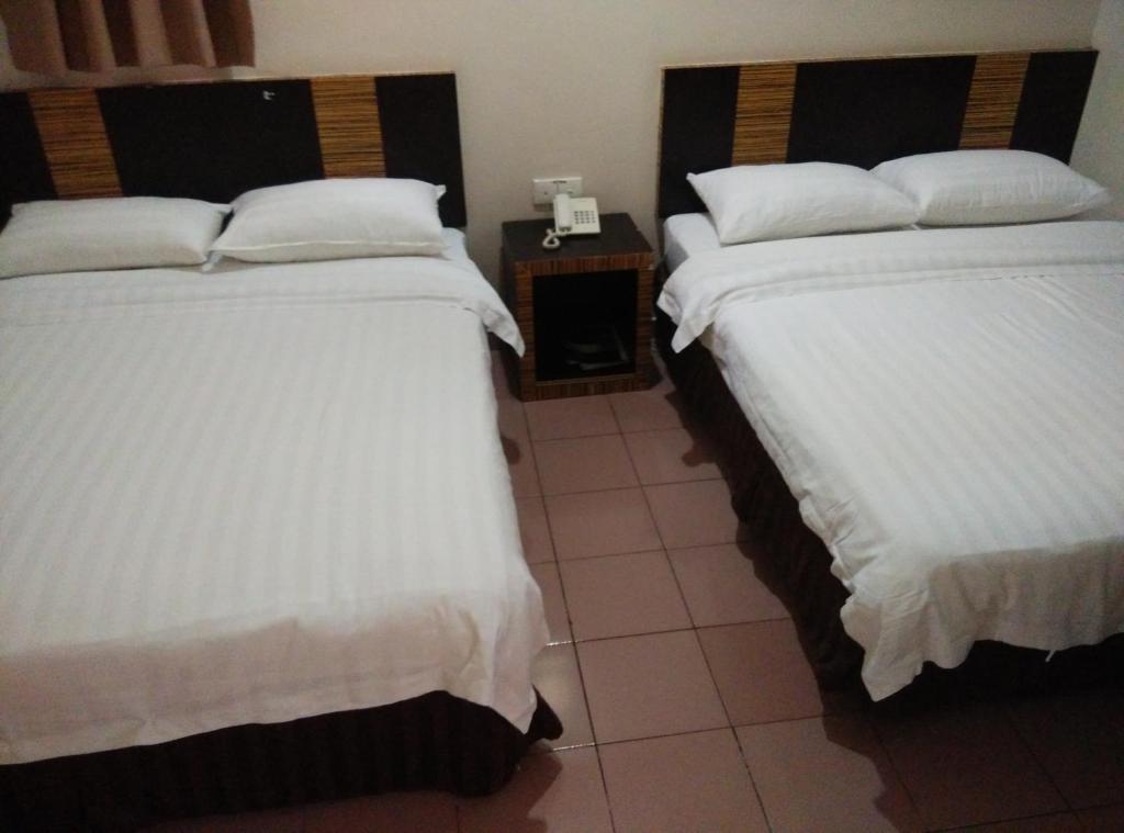 Postel nebo postele na pokoji v ubytování Hotel Traveller