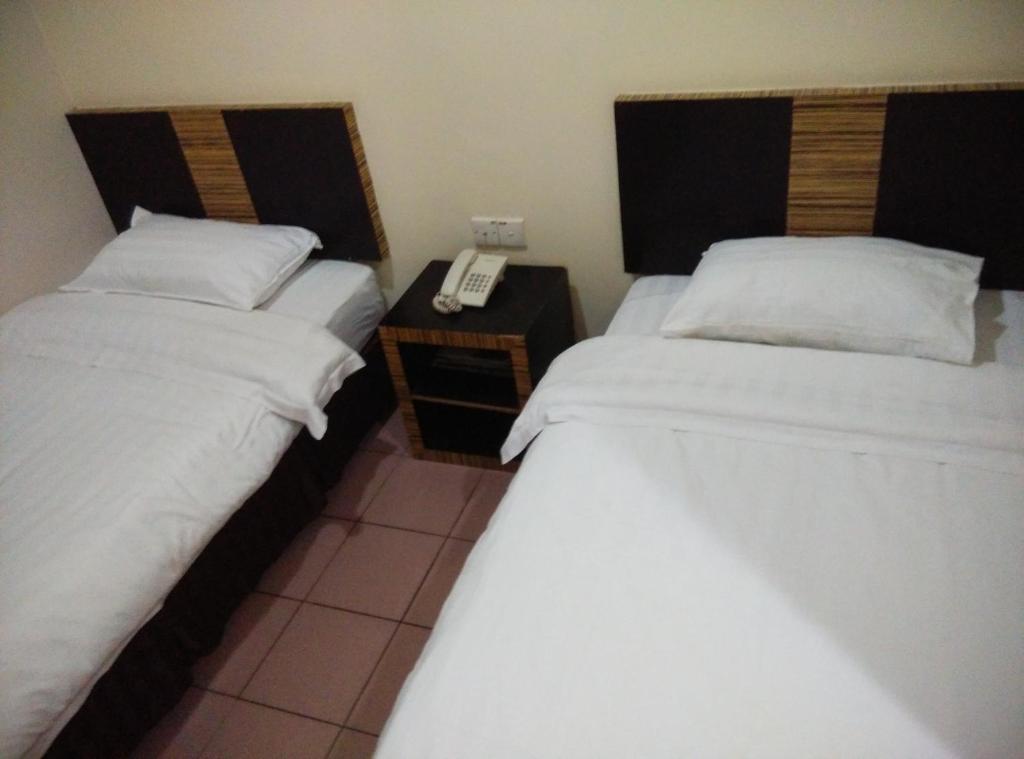 Postel nebo postele na pokoji v ubytování Hotel Traveller