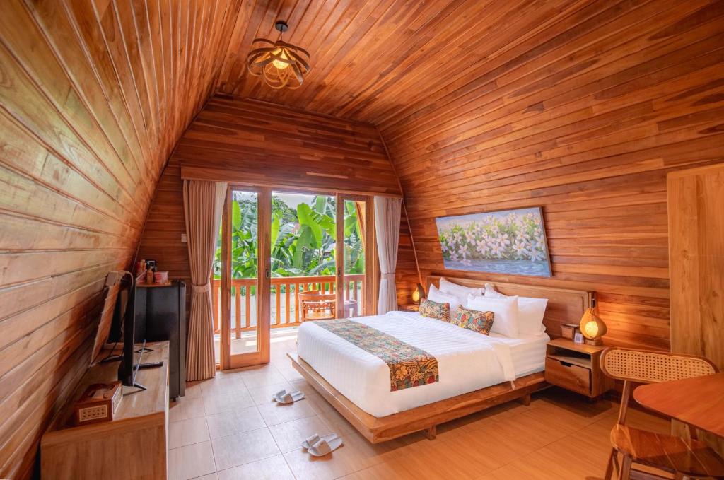 Voodi või voodid majutusasutuse Uma Nandhi Villa Ubud toas