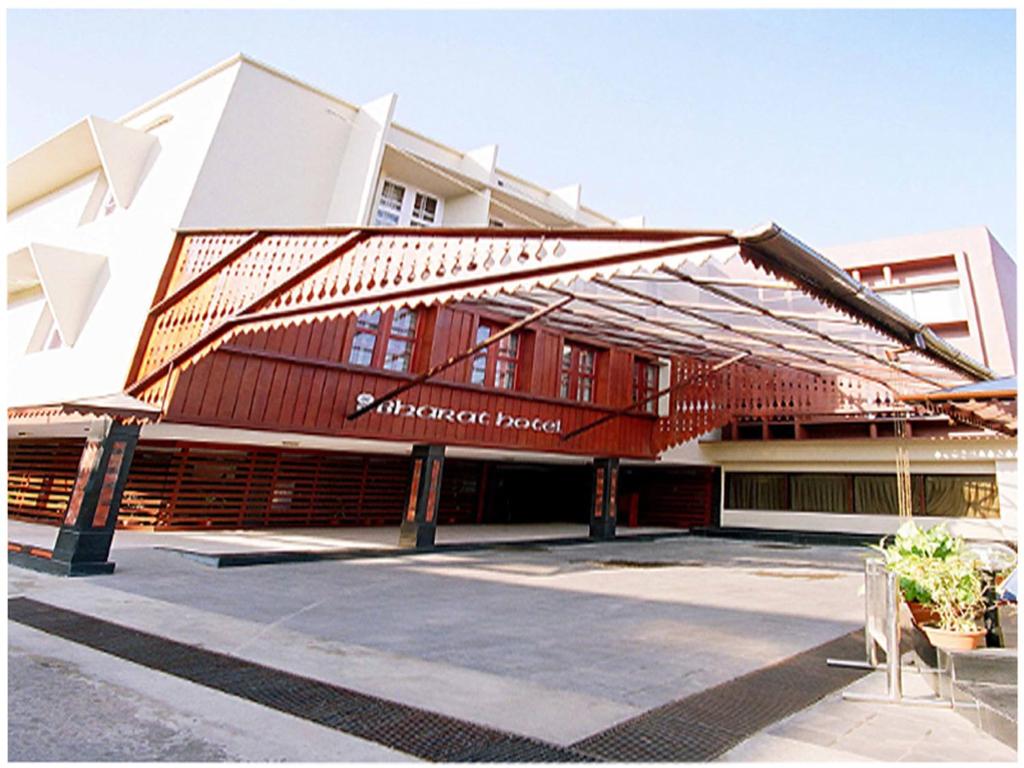 a building with awning on the front of it at Bharat Hotel in Cochin