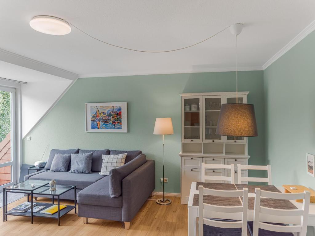 a living room with a couch and a table at Objekt-Nr 64 - Priwall - Wiekstraße in Priwall