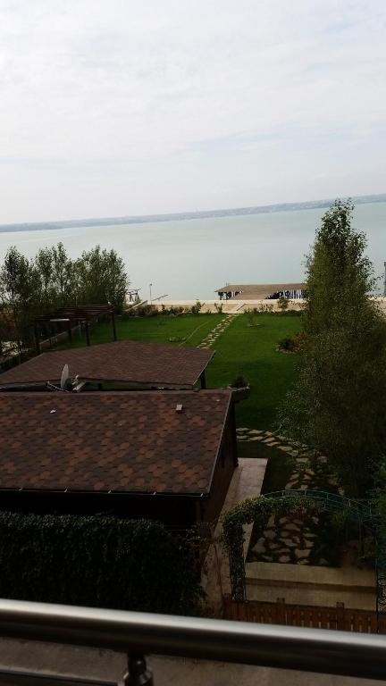 a view of the ocean from a house at Miraj Apartaments - Exclusive Residence in Mamaia