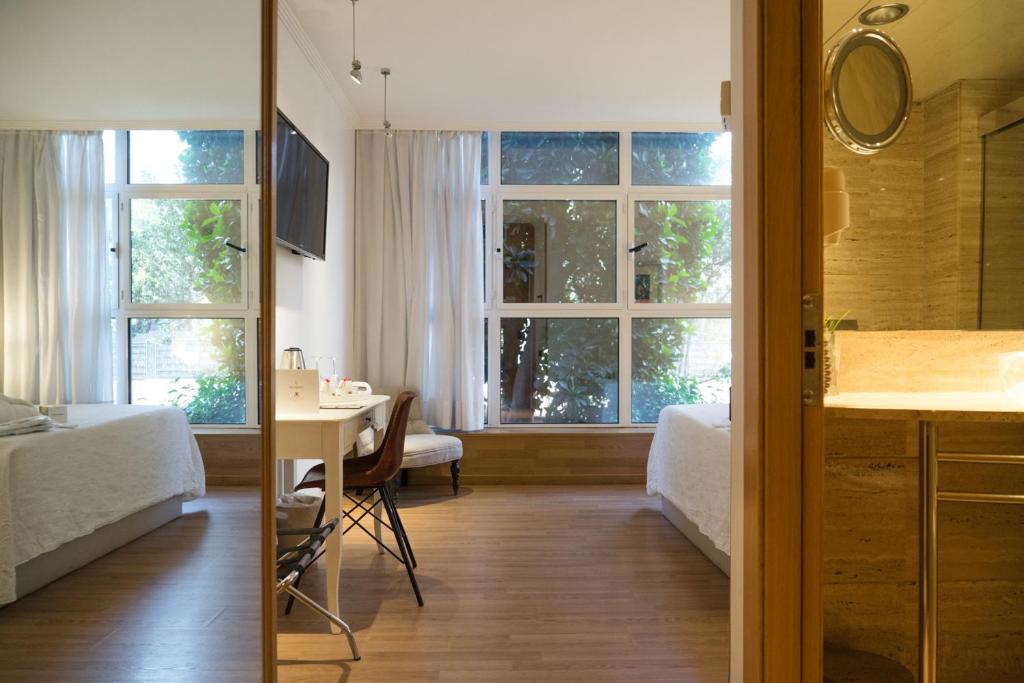 Postel nebo postele na pokoji v ubytování Vilana Hotel Boutique