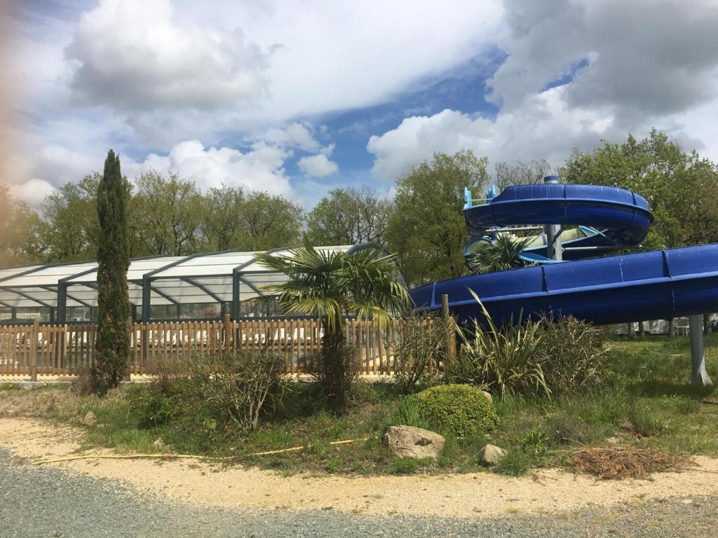 a blue water slide in front of a building at MH First 6pers 30min PuyduFou HellFest in La Boissière-de-Montaigu