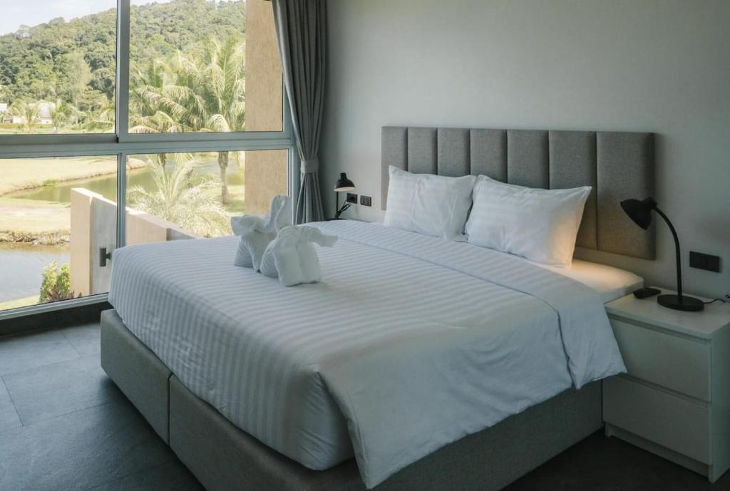 Ένα ή περισσότερα κρεβάτια σε δωμάτιο στο Private Pool Villa Melina - Koh Chang
