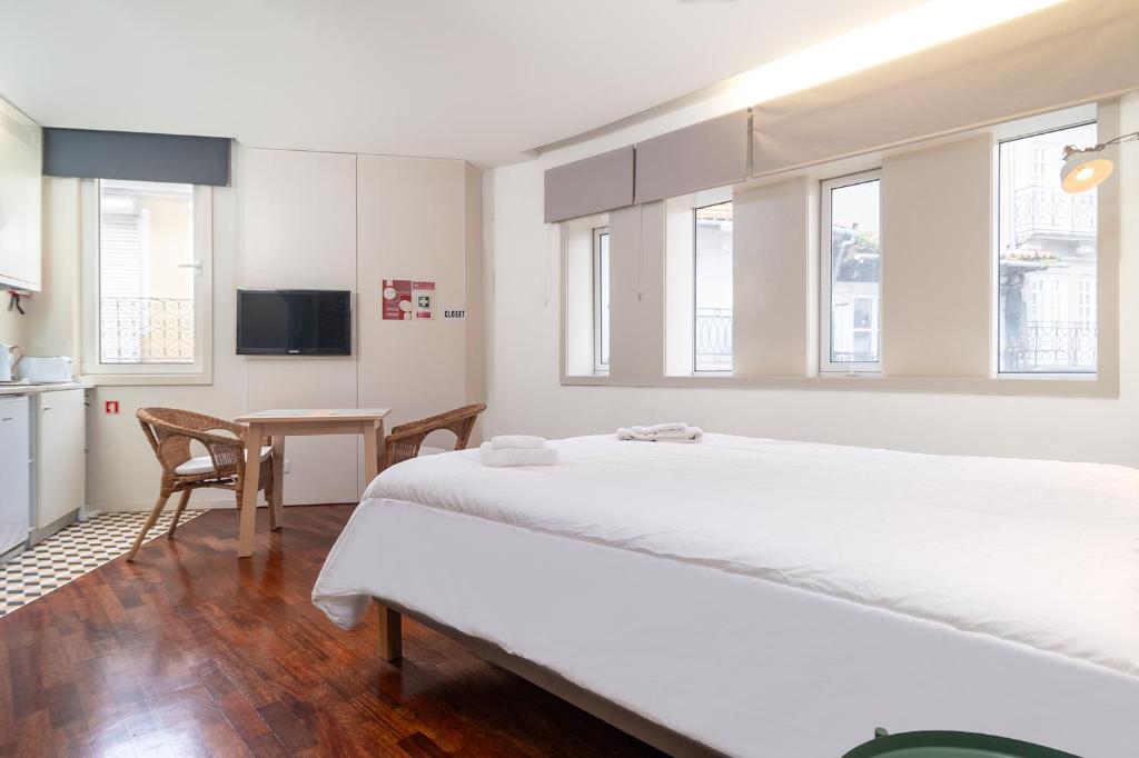 Postel nebo postele na pokoji v ubytování Oporto Riverside Rooftop